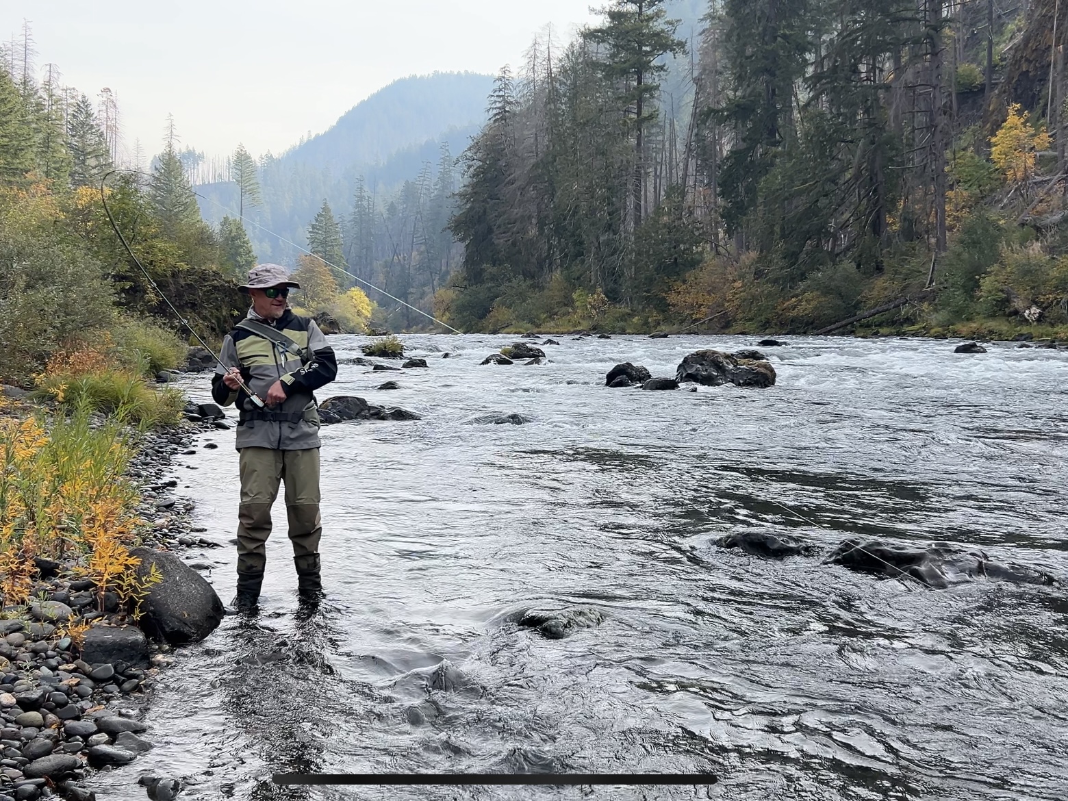 Angler on rocky river